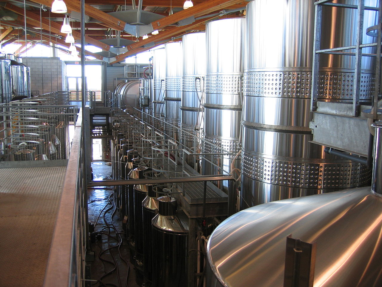 large metallic industrial tanks that need tank cleaning