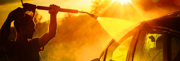 man-washing-car-at-sunset Vehicle Washing at Sunset Hot Summer Afternoon Car Washing. High Pressure Water Washing.