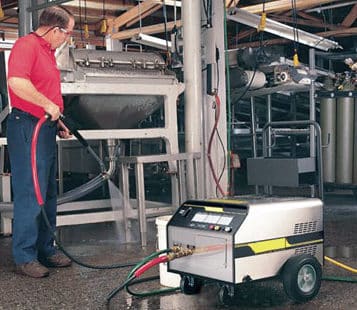 Man washing floor with Q Break Soap