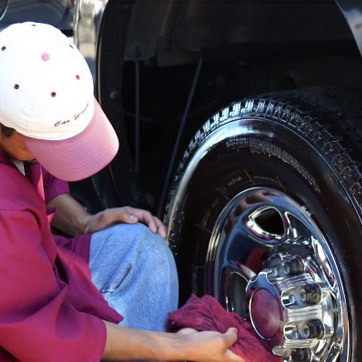 Man Washing tire with Wet Sheen