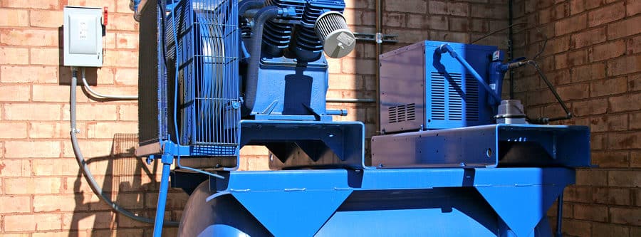 bright blue air compressor on commercial building