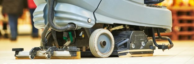 maximize-your-floor-scrubber Close-up of a floor cleaning machine on a tiled surface.