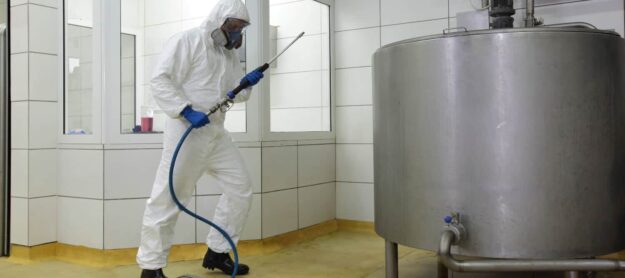 How do pressure washers work (1) Close-up of a textured surface with multicolored, iridescent patterns, featuring streaks of blue, purple, green, and yellow.